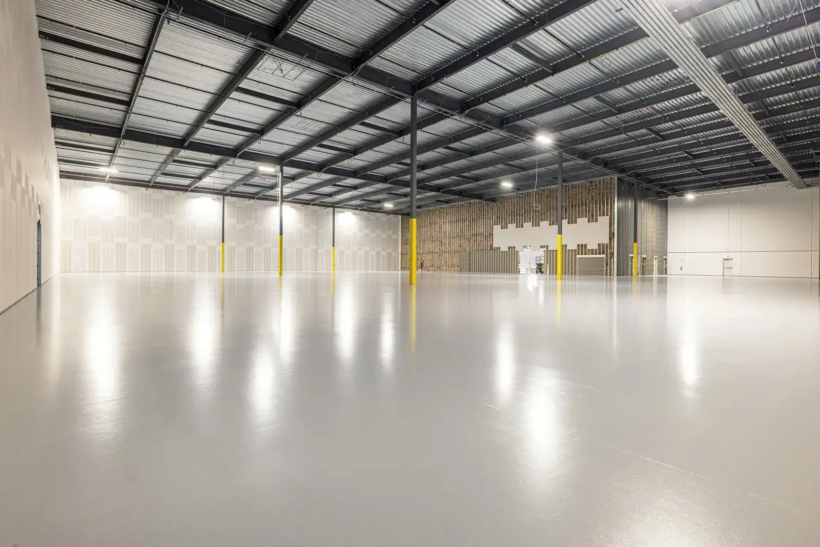 Empty industrial warehouse with a polished concrete floor