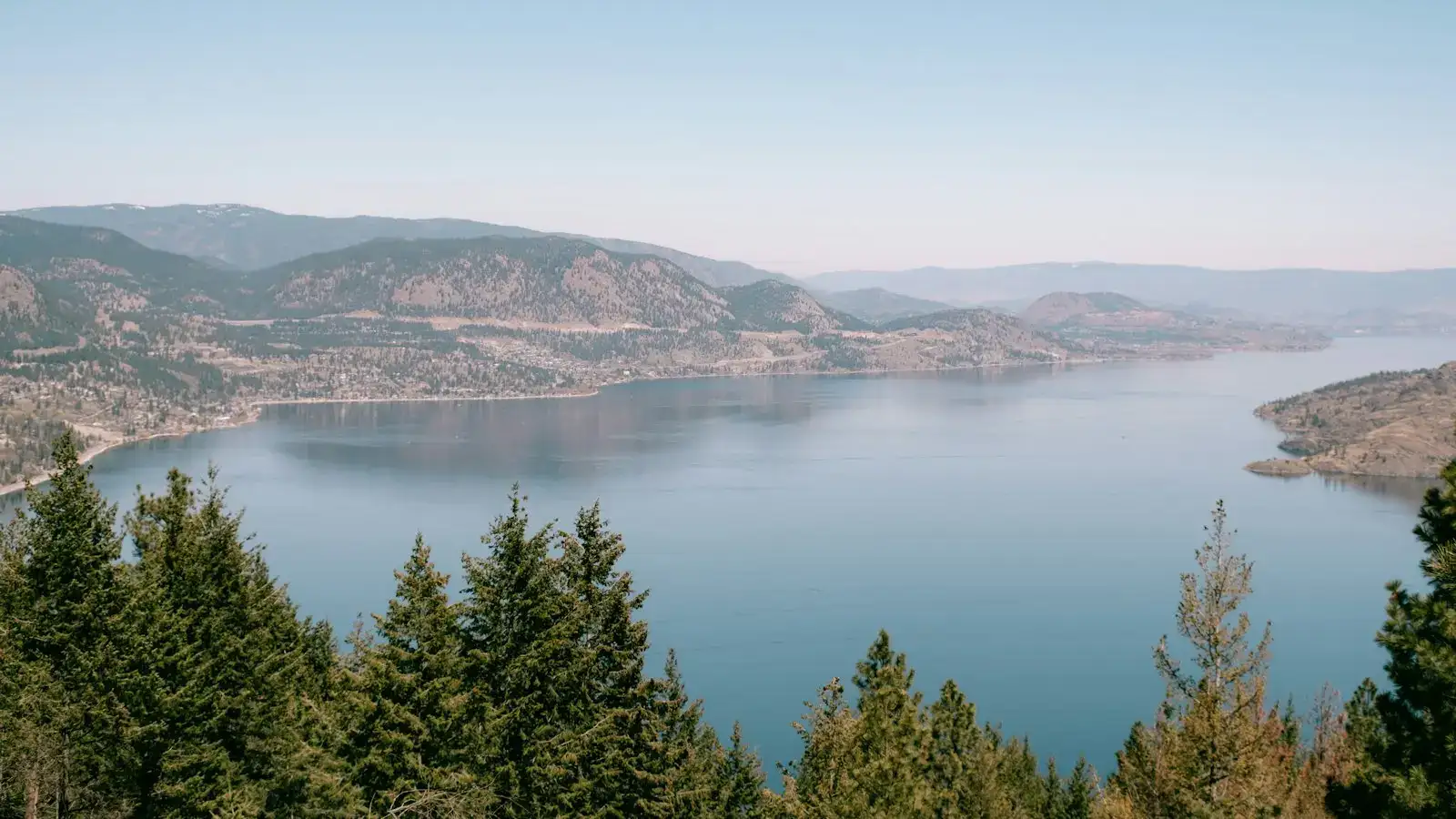 Okanagan Lake and forested hills seen from above